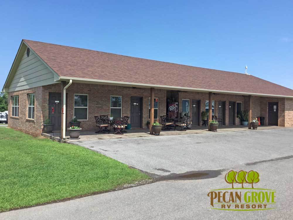 The brick lodge building with a covered porch and patio furniture